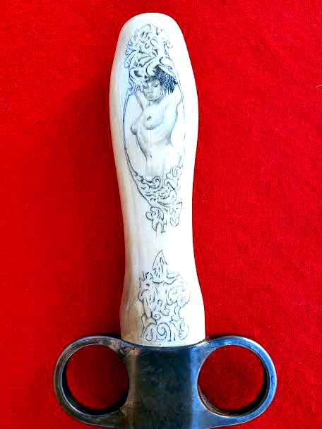 Stunning detailed scrimshaw.